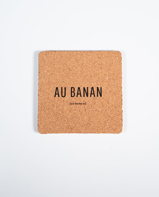 Quadratischer Kork-Untersetzer mit schwarzem Aufdruck „AU BANAN“